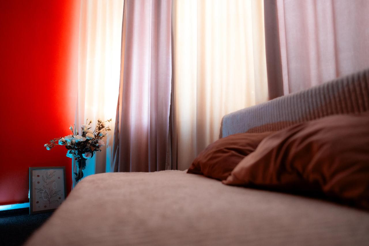 Bedroom set · cinematic red wall