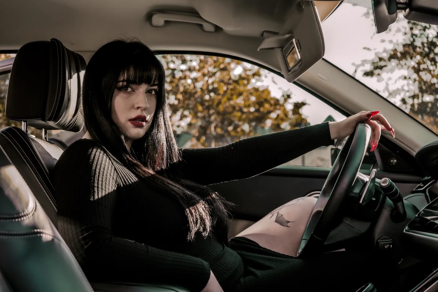 Driver seat portrait · black dress editorial
