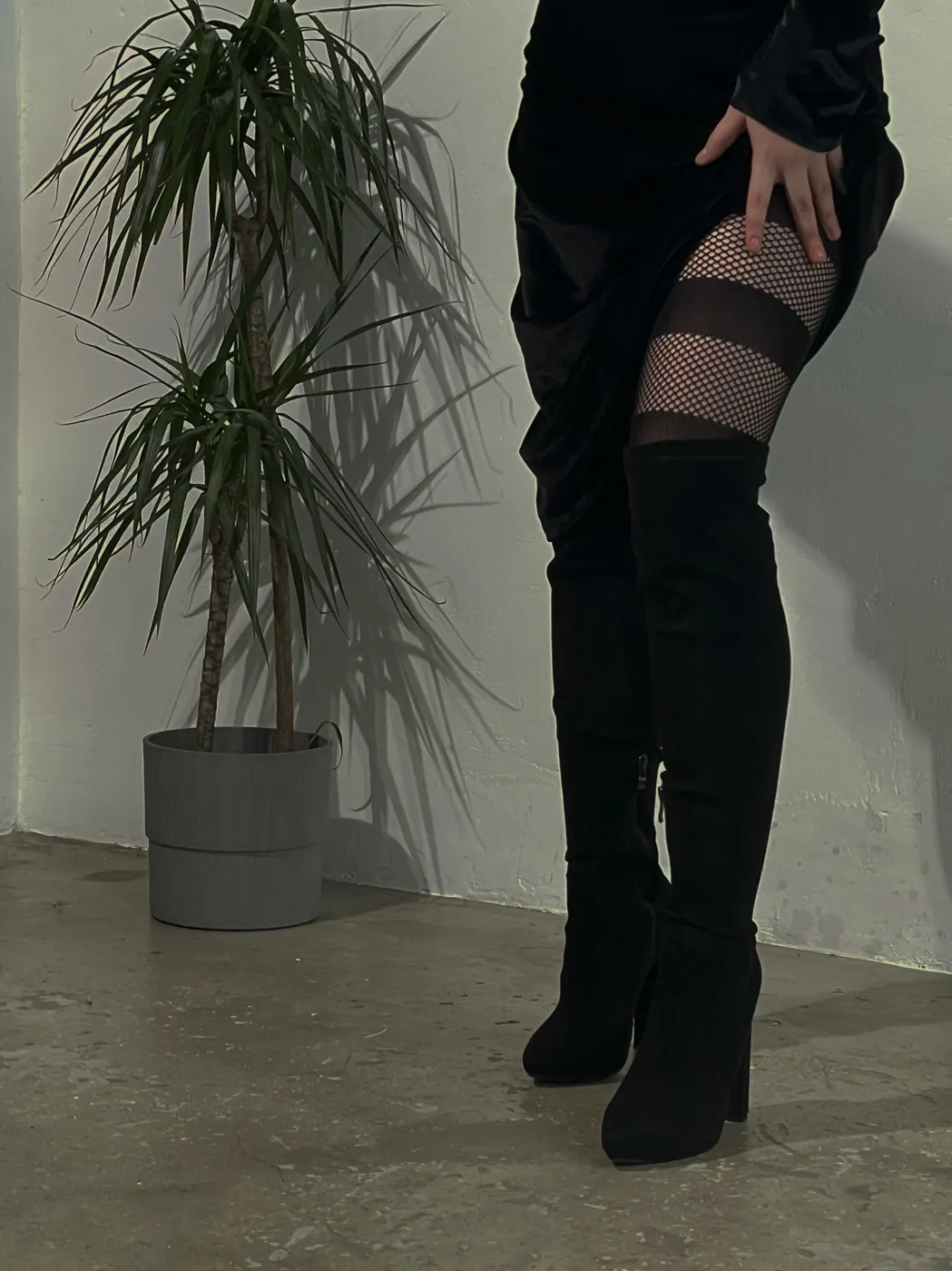 Fishnet & thigh-highs · studio pose