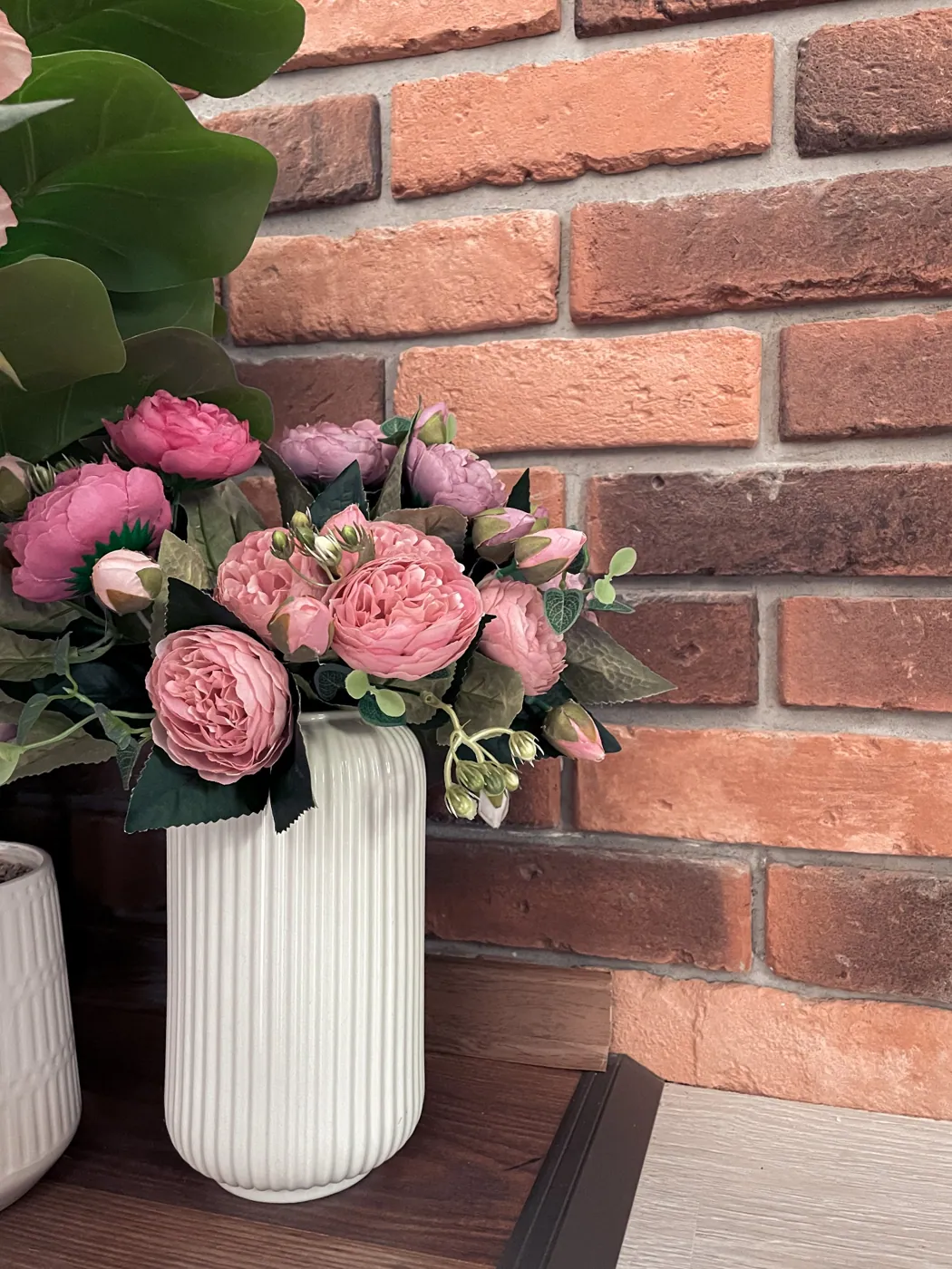 Peonies bouquet · brick wall vignette